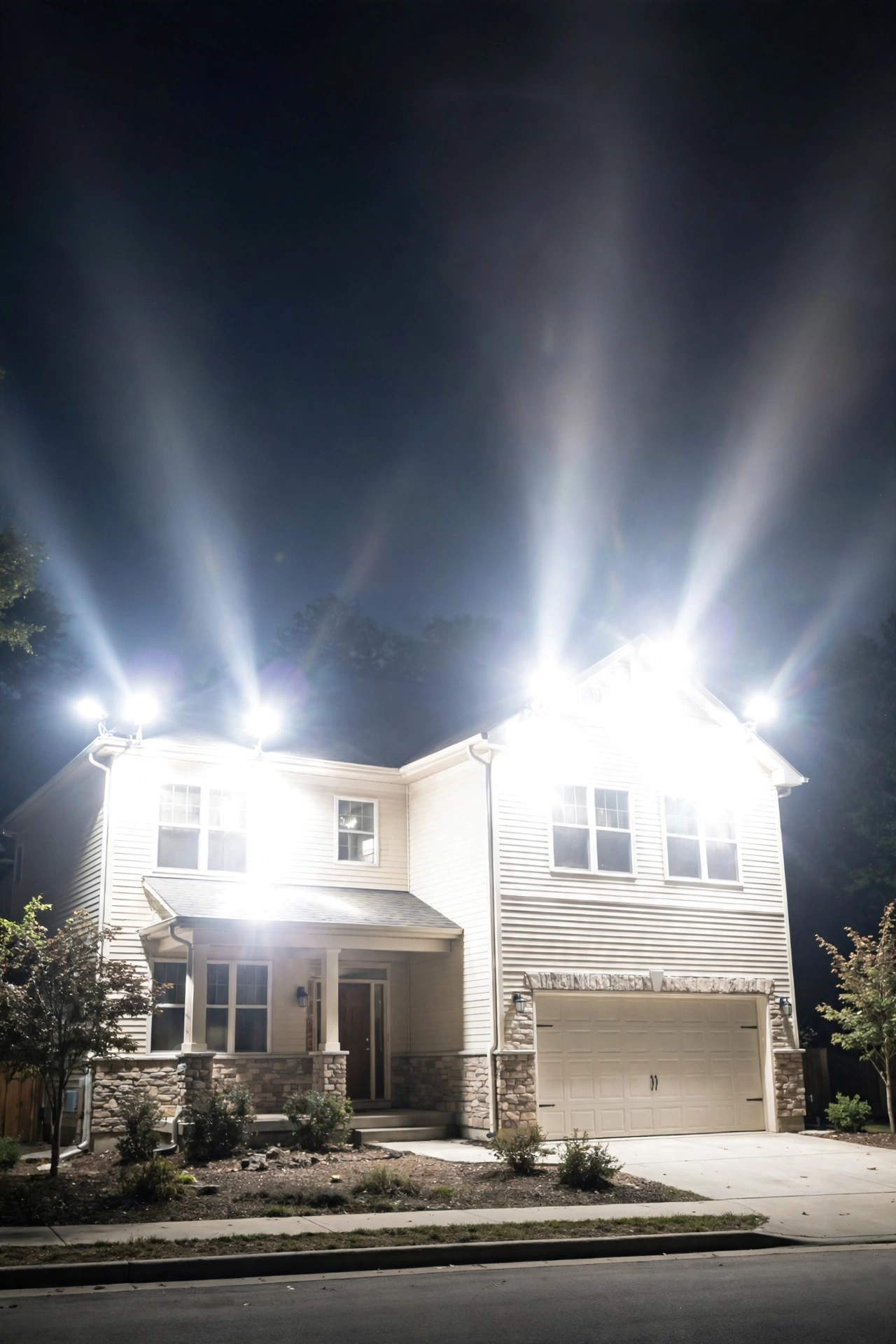 Over-lit house facade at night showing glare and light pollution mistakes to avoid